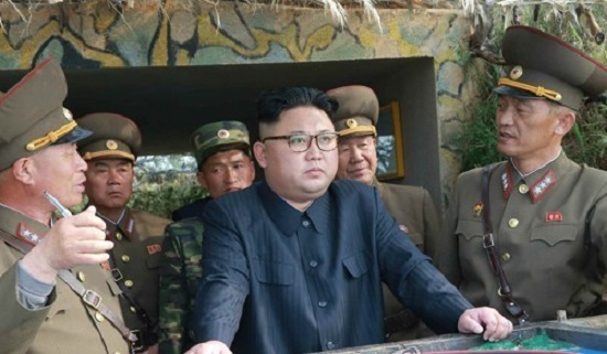 This photo carried by the Rodong Sinmun, North Korea's main newspaper, on May 5, 2017, shows North Korean leader Kim Jong-un (C) inspecting military detachments on two islets in waters off the country's southwest front. (For Use Only in the Republic of Korea. No Redistribution) (Yonhap)