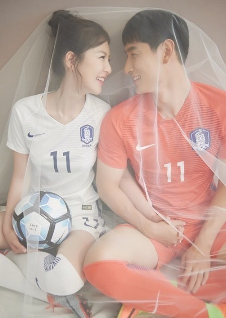 In this photo provided by iwedding on June 2, 2017, South Korean footballer Ji Dong-won poses for a photo with his soon-to-be-wife. (Yonhap)