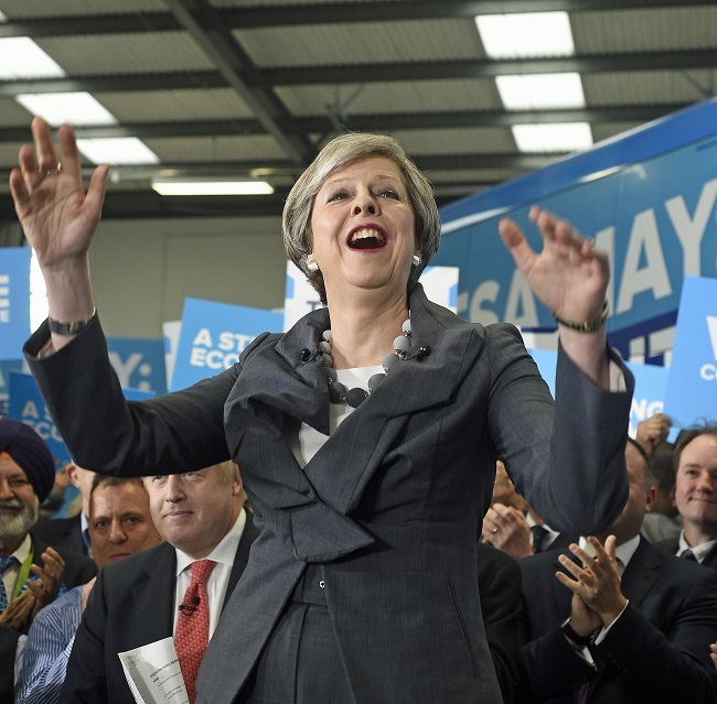 British Prime Minister Theresa May delivers a speech during a Conservative Party campaing event at the Segro office block on Slough Industrial Park, Slough, west of London, Britain 06 June 2017. (EPA-Yonhap)