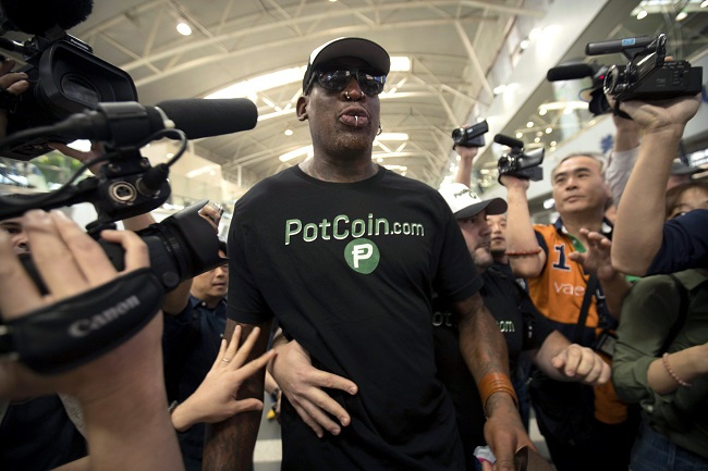 Former NBA basketball player Dennis Rodman arrives at Beijing Capital International Airport in Beijing, Tuesday, June 13, 2017. (AP-Yonhap)