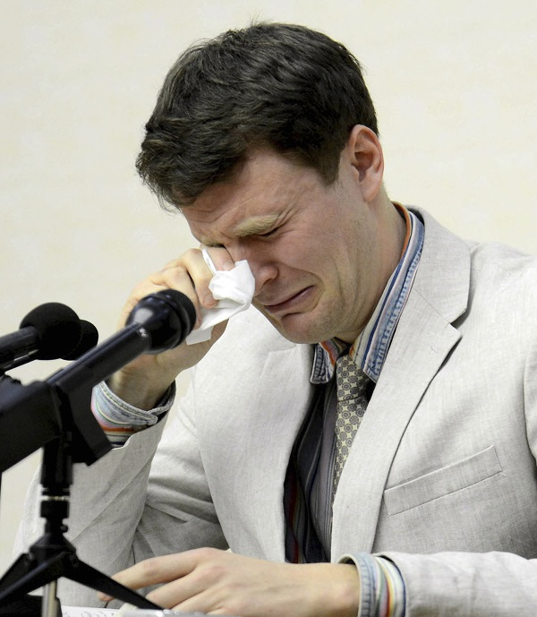 American student Otto Warmbier cries while speaking to reporters in Pyongyang, North Korea. (AP-Yonhap)