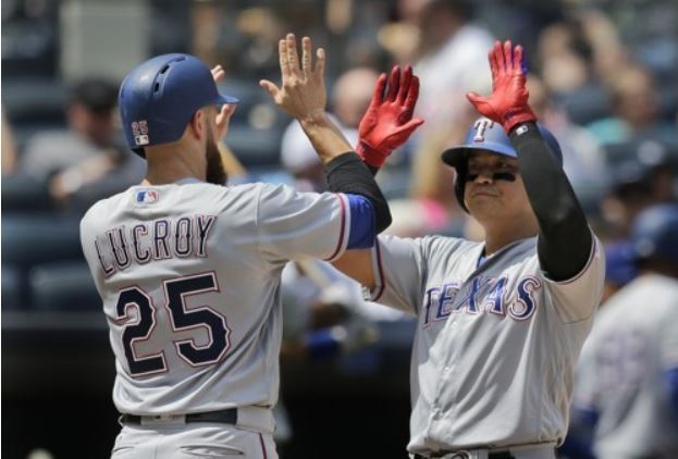 Choo Shin-soo of the Texas Rangers (R) celebrates his three-run home run with Jonathan Lucroy in the second inning of a Major League Baseball game against the New York Yankees at Yankee Stadium in New York on June 25, 2017. (Yonhap-AP)