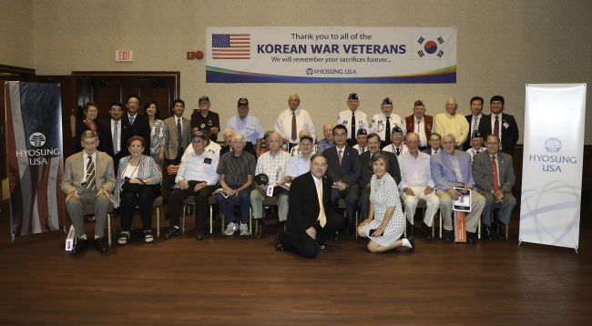 Veterans pose at an event hosted by Hyosung USA (Hyosung Group)