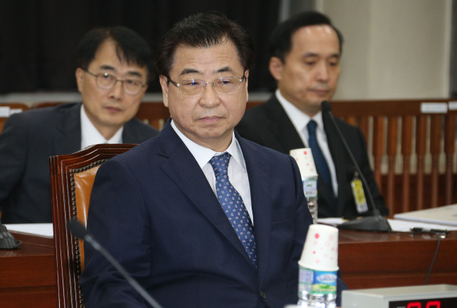 National Intelligence Service director Suh Hoon awaits a parliamentary session on Tuesday. (Yonhap)