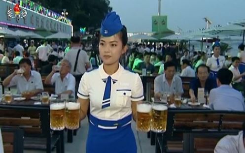 This image captured from footage aired by North Korea's state TV station on Aug. 13, 2016, shows the country's first Pyongyang Taedonggang Beer Festival. (For Use Only in the Republic of Korea. No Redistribution) (Yonhap)