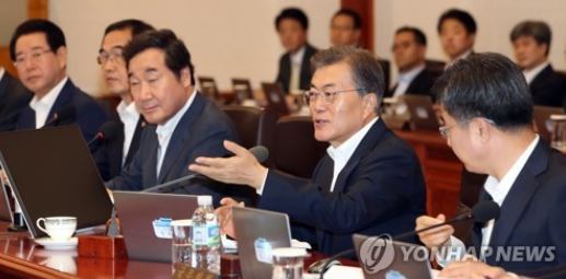 President Moon Jae-in (second from R) speaks during a Cabinet meeting held at the presidential office Cheong Wa Dae on July 25, 2017, the first of its kind involving only new Cabinet members appointed by the new president, who took office in May. (Yonhap)