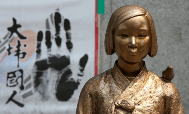 A “comfort woman” statue outside the Japanese Embassy in Jongno, central Seoul. Yonhap