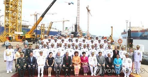 In this photo provided by Daewoo Shipbuilding & Marine Engineering Co., participants at a delivery ceremony of a submarine pose for a photo at its shipyard on Geoje Island, off the country's southern coast on Aug. 2, 2017. The shipbuilder handed over the submarine to Indonesia, becoming the first South Korean company to export a submarine. (Yonhap)