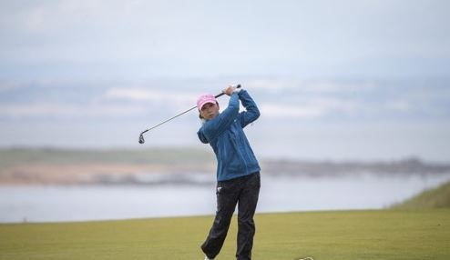 In this Associated Press photo, Kim In-kyung of South Korea watches her shot at the fourth hole during the third round of the Ricoh Women's British Open at Kingsbarns Golf Links in Fife, Scotland, on Aug. 5, 2017. (Yonhap)