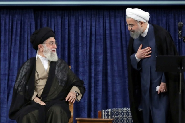 Iranian President Hasan Rouhani (R) speaks with supreme leader Ayatollah Ali Khamenei during his swearing-in on August 3, 2017 (AFP)