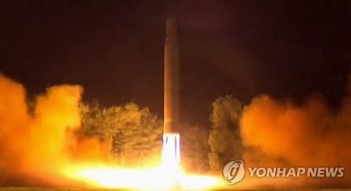 This image captured from footage of North Korea's state broadcaster on July 29, 2017 shows North Korea's firing of an intercontinental ballistic missile a day earlier. (For Use Only in the Republic of Korea. No Redistribution) (Yonhap)
