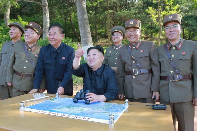 An undated photo made available by the North Korean Central News Agency (KCNA), the state news agency of North Korea, shows North Korean Supreme Leader Kim Jong-un (C) supervising the test-fire of a ground-to-ground medium-to-long range strategic ballistic missile Pukguksong-2 at an undisclosed location in North Korea (reissued 29 July 2017).