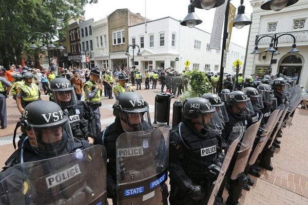 Virginia State Police cordon off an area around the site where a car ran into a group of protesters after a white nationalist rally in Charlottesville, VA (AP)