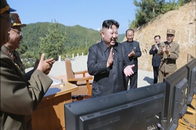 North Korean leader Kim Jong-un (C) applauding the launch of a Hwasong-14 intercontinental ballistic missile, ICBM, in North Korea's northwest. (AP)