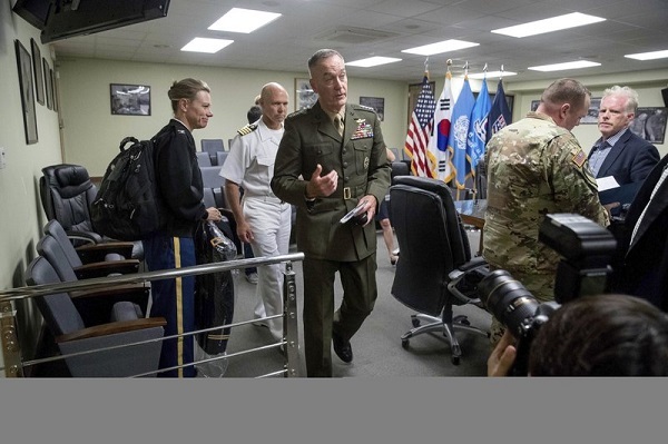 Joint Chief Chairman Gen. Joseph Dunford, center, departs following a news conference at US Army Garrison Yongsan, Seoul, South Korea, Monday, Aug. 14, 2017. The top US military officer told his counterparts in South Korea on Monday that the US is ready to use the "full range" of its military capabilities to defend itself and its allies from any North Korean provocation. (AP)