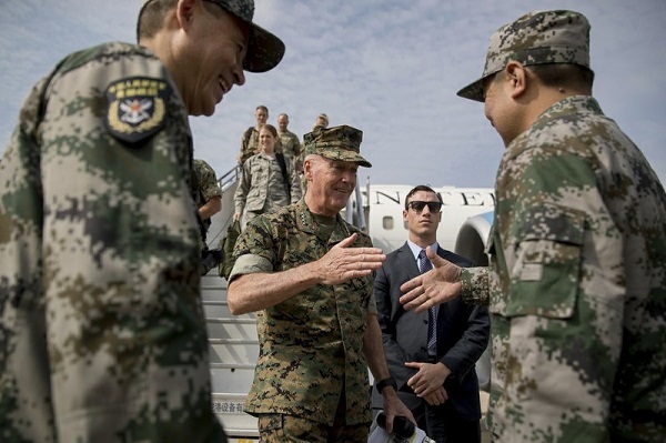 Joint Chiefs Chairman Gen. Joseph Dunford, center, is greeted by Chinese military officials as he arrives in Shenyang, China, Wednesday, Aug. 16, 2017, to observe a Chinese Military Exercise. (AP)