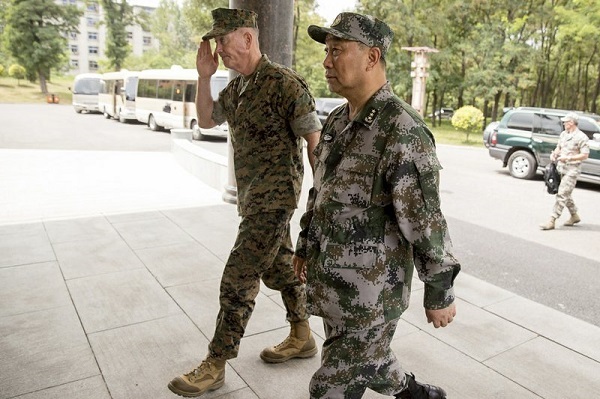 Joint Chiefs Chairman Gen. Joseph Dunford and Chinese Northern Theater Command Commander Gen. Song Puxuan, right, arrive for a meeting at Northern Theater Command Army Force Haichung Camp in Haichung, China, Wednesday, Aug. 16, 2017. (AP