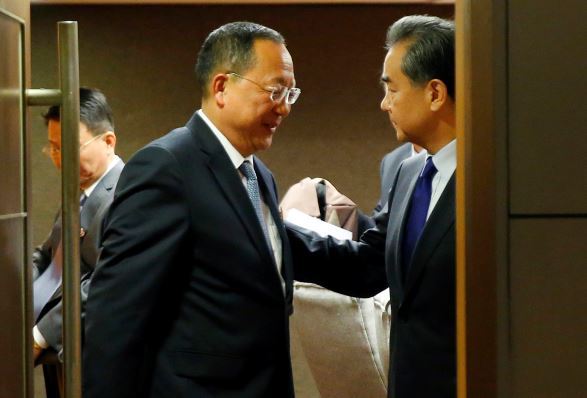 Ri Yong-ho, left, and Wang Yi (AP-Yonhap)