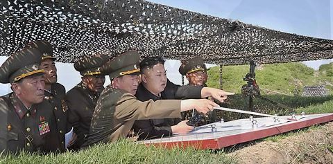 This file photo unveiled by North Korea's state news agency on June 3, 2013, shows North Korean leader Kim Jong-un (C) inspecting a front-line military unit. (For Use Only in the Republic of Korea. No Redistribution) (Yonhap)