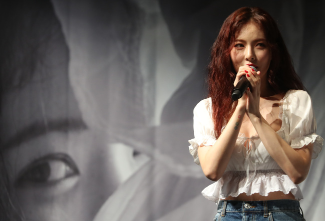HyunA speaks at a press conference held Tuesday in Seoul. (Yonhap)