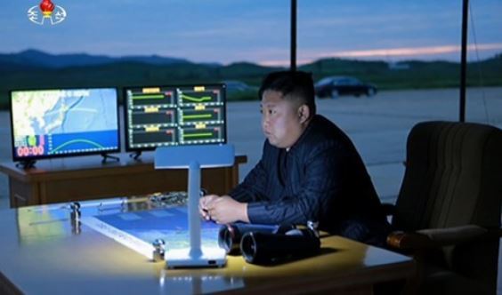 This image captured from footage by North Korea's state TV broadcaster on Aug. 30, 2017, shows North Korean leader Kim Jong-un watching the firing of a Hwasong-12 intermediate-range ballistic missile that flew over Japan.