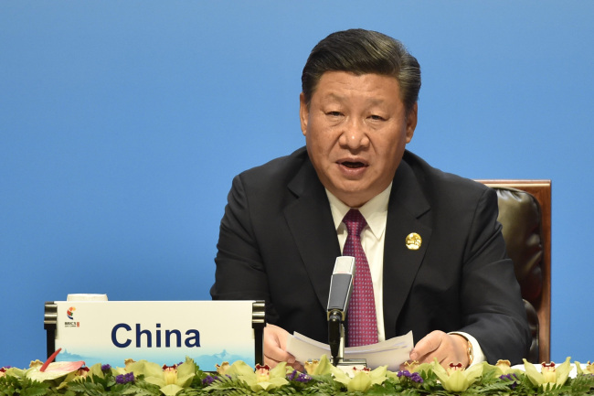 Chinese President Xi Jinping delivers a speech ahead of the signing ceremony of the BRICS Business Council at the BRICS Summit in Xiamen on September 4, 2017. Leaders of the BRICS grouping of emerging economies said September 4 they "strongly deplore" North Korea's latest nuclear test and hydrogen-bomb claim, which has overshadowed the five-nation group's annual summit. (AFP)