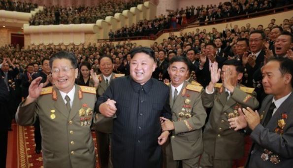 This file photo, released by the Korean Central News Agency on Sept. 10, 2017, shows North Korean leader Kim Jong-un holding hands with other ranking officials at a banquet in celebration of its latest nuclear test conducted on Sept. 3. (For Use Only in the Republic of Korea. No Redistribution) (Yonhap)