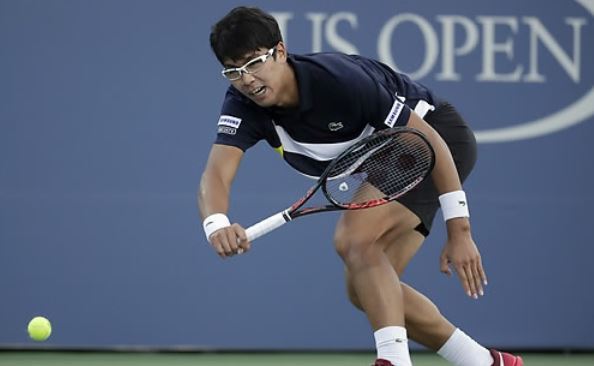 In this photo taken by the Associated Press on Aug. 30, 2017, South Korean tennis player Chung Hyeon competes against John Isner of the United States during their second round men's singles match at the US Open at Billie Jean King National Tennis Center in New York. (Yonhap)