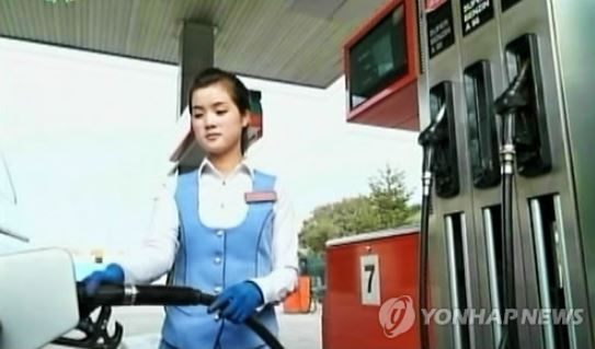This file photo shows a worker at a gas station in Pyongyang. (Yonhap)