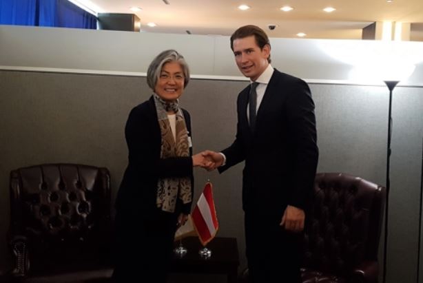 FM Kang Kyung Wha (L) shakes hands with Austrian FM
