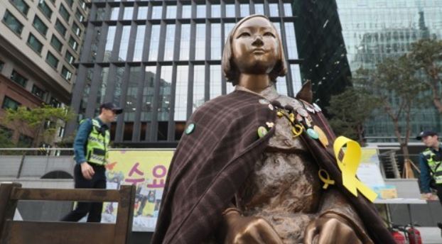 A bronze statue symbolizing "comfort women" victims stands near Seoul-based Japanese Embassy in this file photo taken on April 25, 2017. (Yonhap)