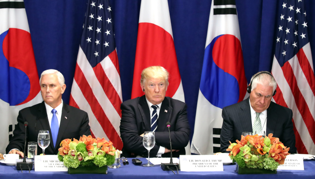 From left: US Vice President Mike Pence, President Donald Trump and Secretary of State Rex Tillerson (Yonhap)