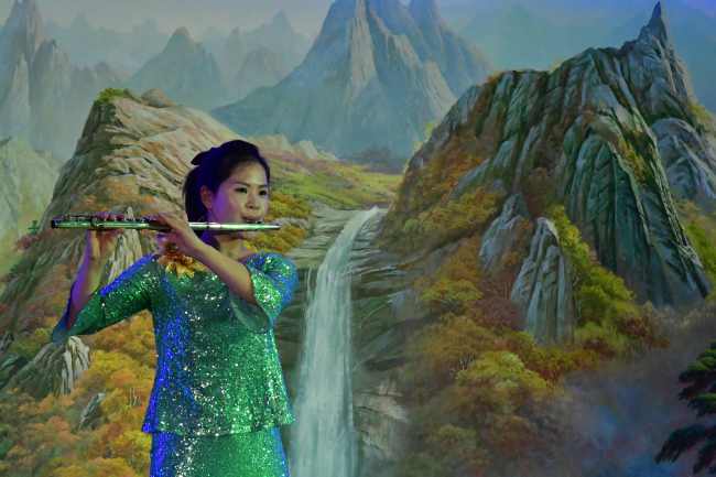 North Korean musician plays a flute at a restaurant in Dubai. Yonhap