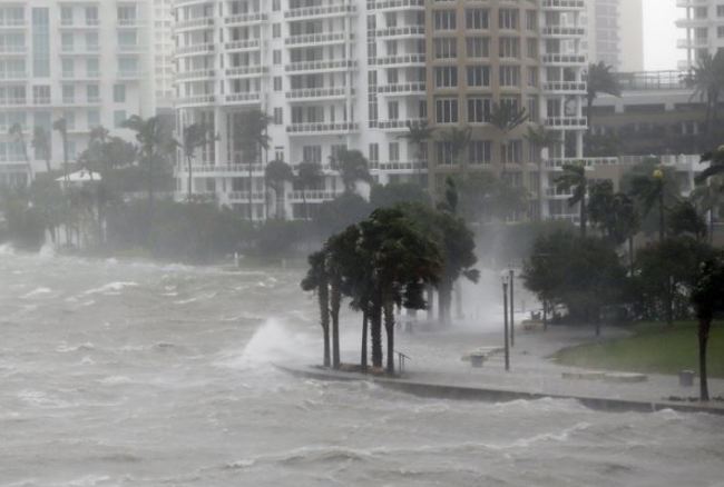 Waves crash over a seawall at the mouth of the Miami River from Biscayne Bay, Fla., as Hurricane Irma passes by, Sunday, Sept. 10, 2017, in Miami. (AP)