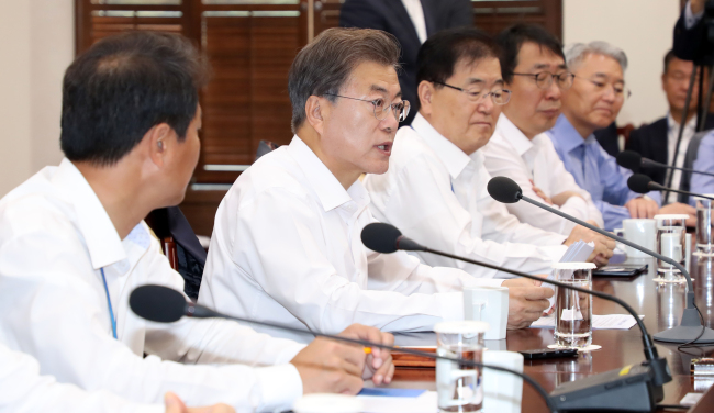 President Moon Jae-in (second from left) speaks during the meeting with senior presidential aides at Cheong Wa Dae in Seoul on Tuesday. Yonhap