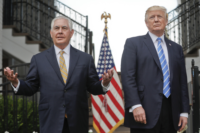 In this Aug. 11, 2017, file photo, Secretary of State Rex Tillerson, left, speaks following a meeting with President Donald Trump (AP-Yonhap)