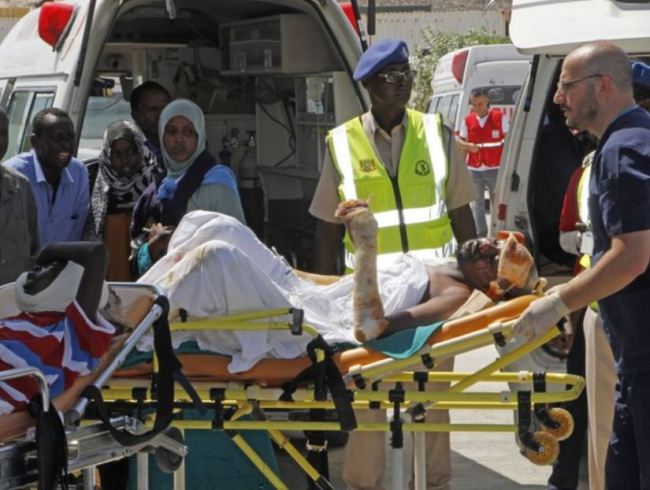Turkish doctors transport a critically wounded man on a stretcher to a waiting Turkish air ambulance to airlift injured patients for treatment in Turkey, in Mogadishu, Somalia, Monday, Oct,16, 2017. The death toll from Saturday’s truck bombing in Somalia’s capital now exceeds 300, the director of an ambulance service said Monday, as the country reeled from the deadliest single attack. (AP