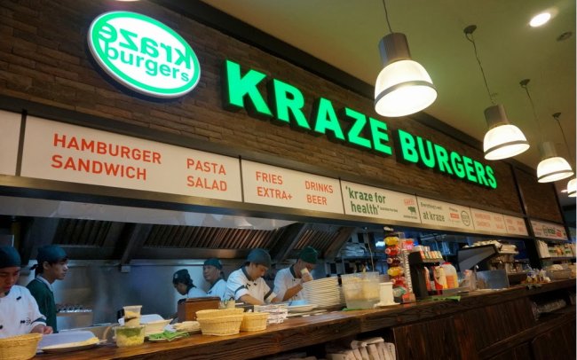 Kraze Burger Korea premium burger chain acquired by LF Food for 1 billion won in October 2017 after liquidity crisis and failed overseas expansion, showing the once-popular Gangnam-era brand signage