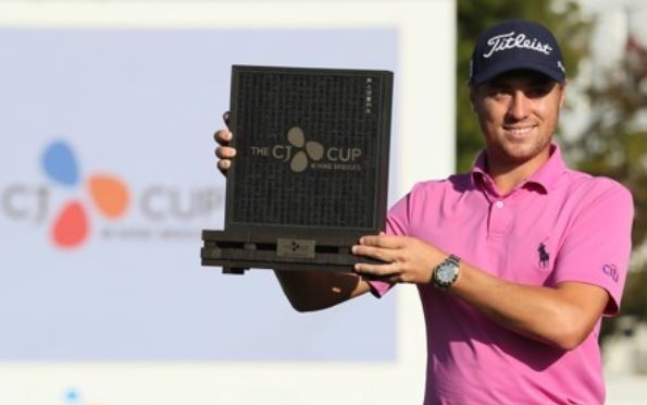 Justin Thomas of the United States hoists the champion's trophy after winning the PGA Tour's CJ Cup @ Nine Bridges at the Club at Nine Bridges in Seogwipo, Jeju Island, on Oct. 22, 2017.