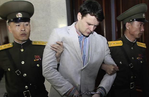 This AP photo shows Otto Warmbier (C) being taken to a Pyongyang court in March 2016. (Yonhap)