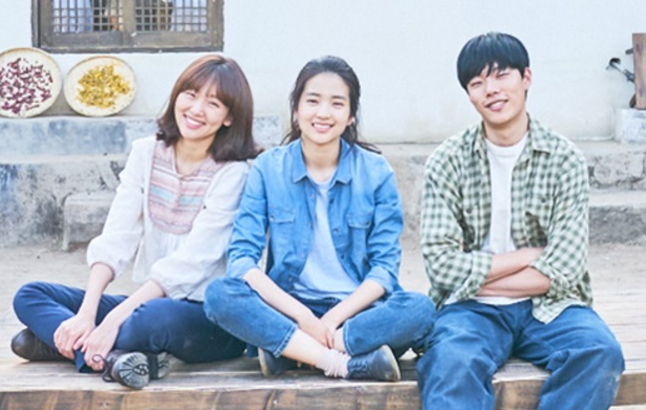 Kim Tae-ri as Hye-won in a wrapped production still from Little Forest 2018 directed by Yim Soon-rye standing in the rural North Gyeongsang village where the film was shot