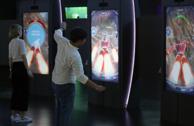 ASIA’S FIRST MARVEL EXPERIENCE CENTER - Visitors to Marvel Experience, a mobile interactive attraction featuring Marvel’s flagship characters including Thor, Iron Man and Spider-Man, experience the facility’s offerings Thursday. The new facility is located in Busan and is the first of its kind to open in Asia. (Yonhap)