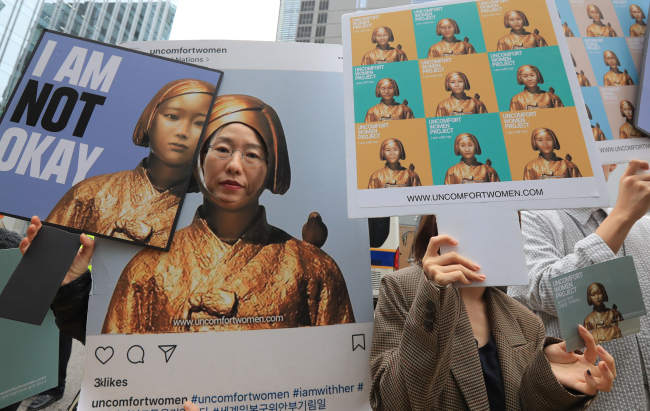 A group of activists protests outside the Japanese Embassy in central Seoul. Yonhap