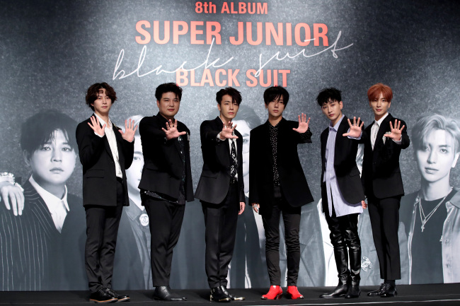 Six members of K-pop act Super Junior pose during a press conference for the group’s new album “Play,” in Seoul on Monday. Choi Si-won has not been participating in the group’s recent promotions. (Yonhap)
