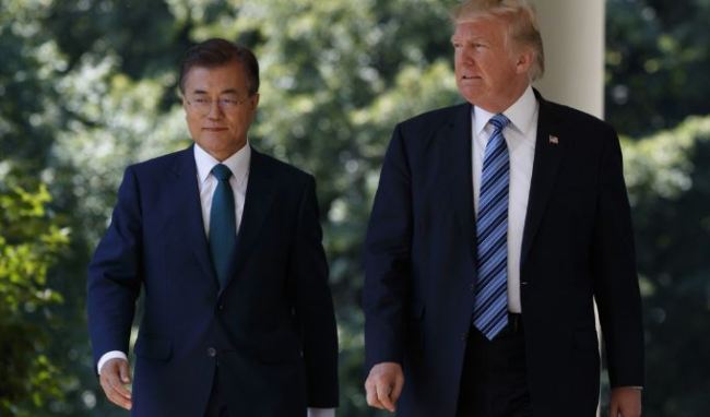 President Donald Trump walks with South Korean President Moon Jae-in to attend a joint press conference in the Rose Garden on June 30. (AP)