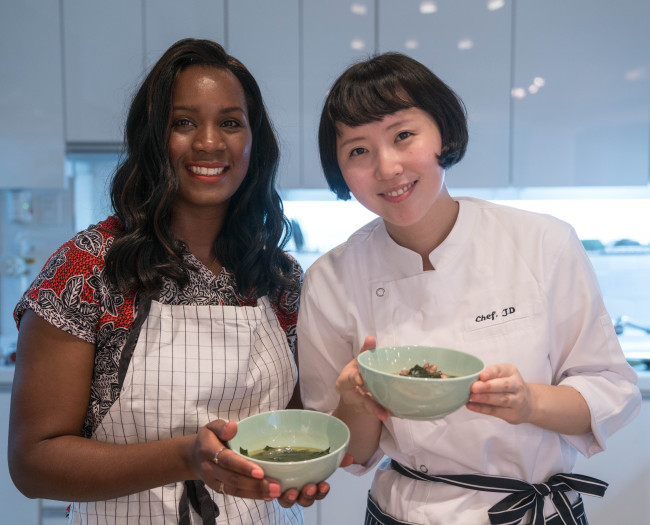 A cooking class participant (left) and chef Lee Min-jung, CEO of I Love Hansik, pose for a photo after a class at the company’s Yeonnam-dong studio on Nov. 7. (I Love Hansik)