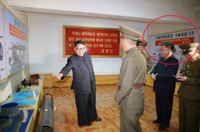 North Korean leader Kim Jong-un visits the Chemical Material Institute of the Academy of Defense Science in this undated photo released by North Korea’s Korean Central News Agency in August. A display titled “Pukguksong-3” (circled) is shown in the background. Yonhap