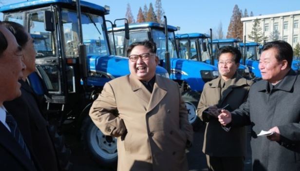 This photo carried by North Korea`s state news agency on Nov. 15, 2017, shows its leader Kim Jong-un (C) inspecting a tractor factory. (For Use Only in the Republic of Korea. No Redistribution) (Yonhap)