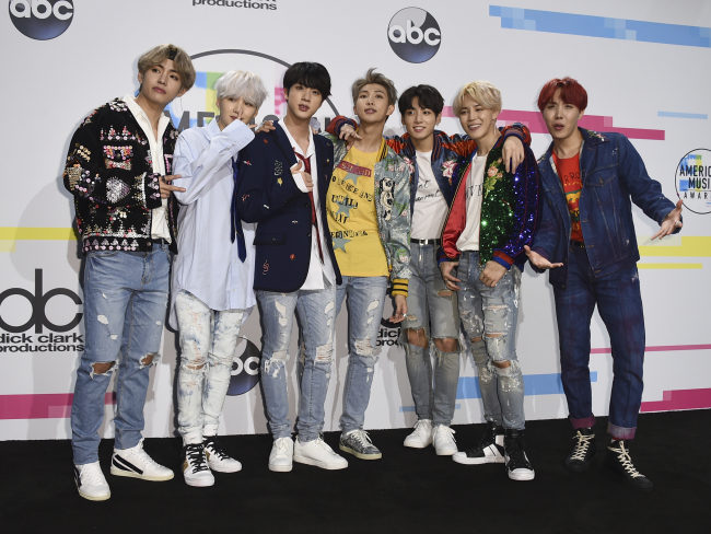 Boy band BTS poses in the press room at the 2017 American Music Awards, on Sunday in Los Angeles, California. (AP-Yonhap)