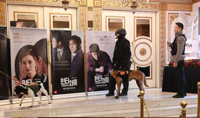 Police search the Imperial Palace Hotel for explosives, Tuesday.